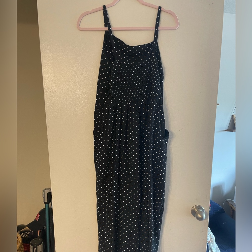 black jumpsuit with white polka dots